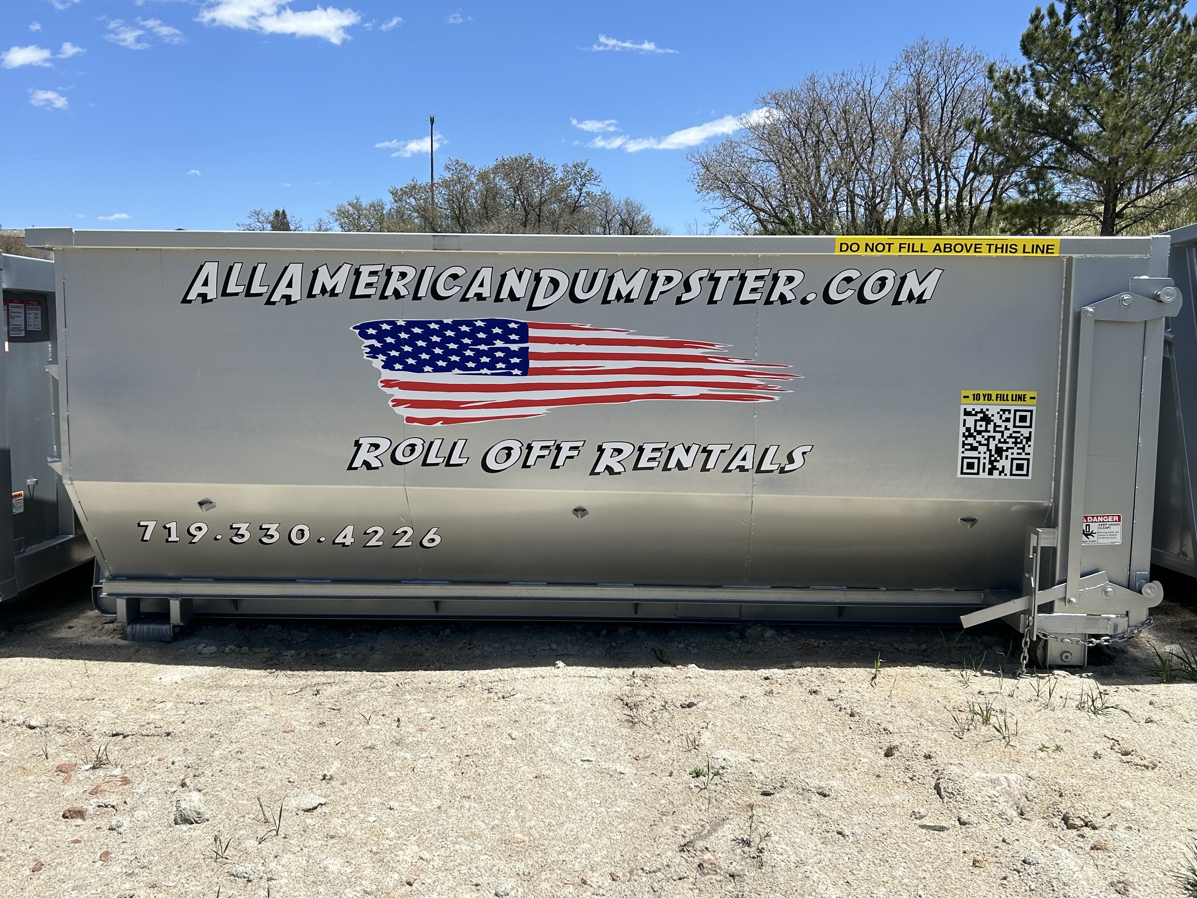 10-yard All American Dumpster showing the yellow maximum loading level band